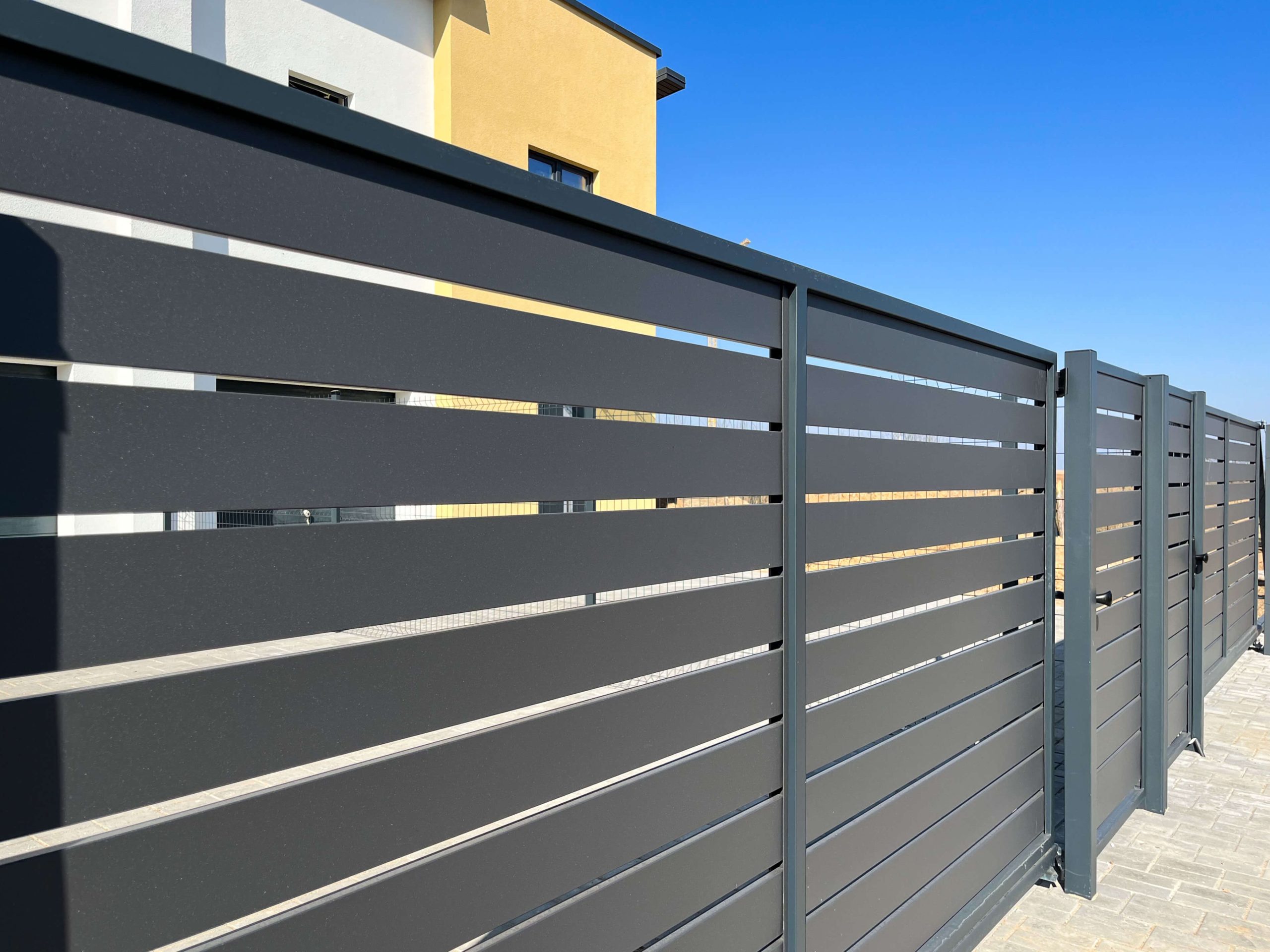 A residential fence featuring a combination of vinyl and Hardy Plank, providing both elegance and durability in San Antonio